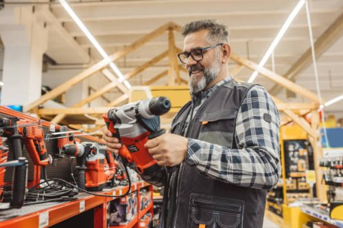 carpenter shopping in hardware store. - home decoration stock pictures, royalty-free photos & images