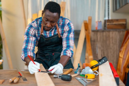 carpenter working on planks at the workshop - home decoration stock pictures, royalty-free photos & images