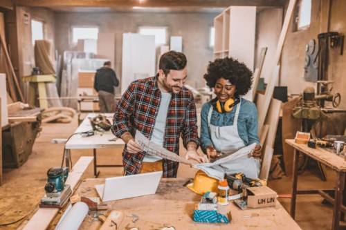 carpenters working at a furniture factory drawing sketches - home decoration stock pictures, royalty-free photos & images