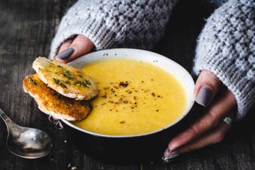 carrot pumpkin cream soup with garlic bread - food stock pictures, royalty-free photos & images