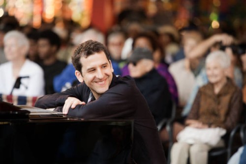 caucasian musician sitting at piano - concert stock pictures, royalty-free photos & images