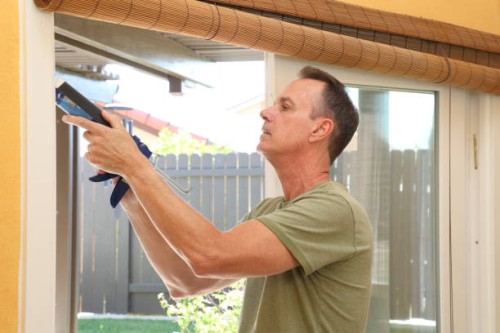 caulking gun man horizontal - home decoration stock pictures, royalty-free photos & images