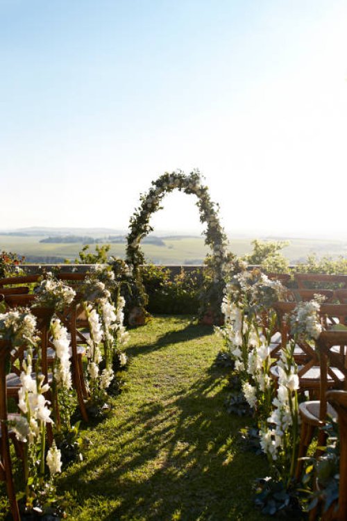 chairs decorated with flower near wedding altar - garden decoration stock pictures, royalty-free photos & images