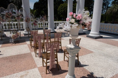 chairs for a wedding reception decorated with fabric or a veil. wedding ceremony in the open air, bouquets of flowers. beautiful decoration and decoration, wedding decor. - garden decoration stock pictures, royalty-free photo
