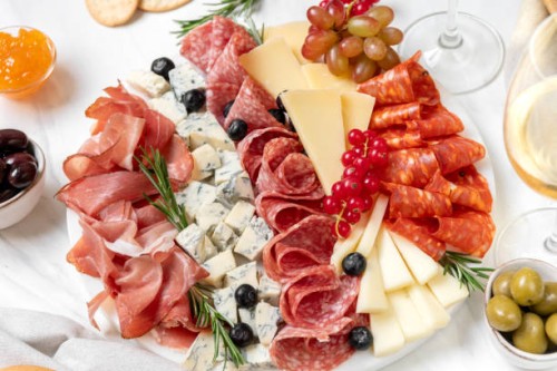 charcuterie board prosciutto ham, salami and cheese. festive serving of cold meat appetizers for lunch or dinner for christmas, new year, wedding, anniversary, birthday party - food stock pictures, royalty-free photos & image