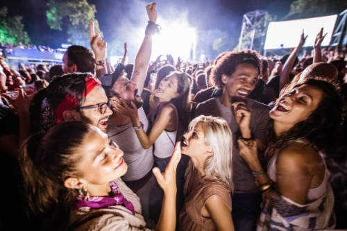 cheerful friends dancing and signing on music festival by night. - concert stock pictures, royalty-free photos & images