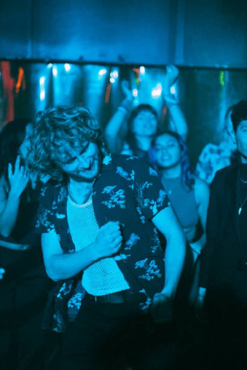 cheerful multiracial male and female friends enjoying while dancing in club - concert stock pictures, royalty-free photos & images