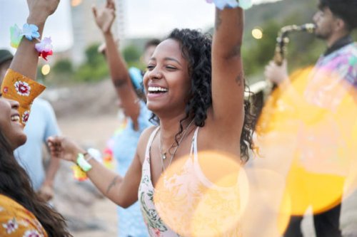 cheerful photo of an african american young woman dancing in a beach party in the summer season. - concert stock pictures, royalty-free photos & images