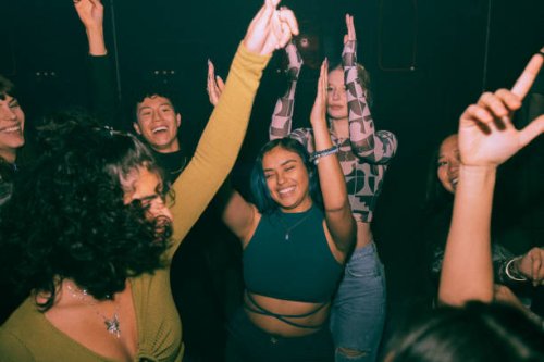 cheerful young friends dancing and enjoying together at nightclub - concert stock pictures, royalty-free photos & images