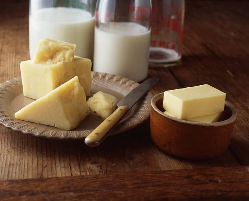 cheese, butter and milk bottles on wooden table - junk food stock pictures, royalty-free photos & images