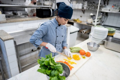 chef chopping vegetables in a commercial kitchen - food stock pictures, royalty-free photos & images