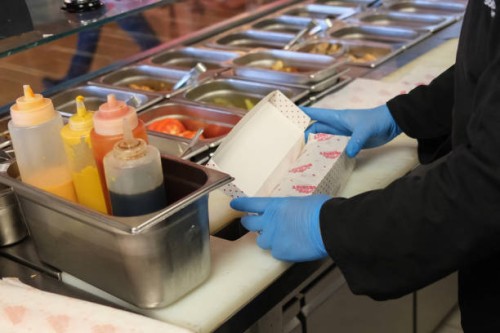 Chef packages takeaway food at a Dubai restaurant on September 4, 2024. Climate negotiators hope to reach the world's first treaty on plastic...