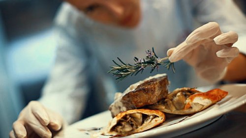 chef placing finishing touches on a meal. - food stock pictures, royalty-free photos & images