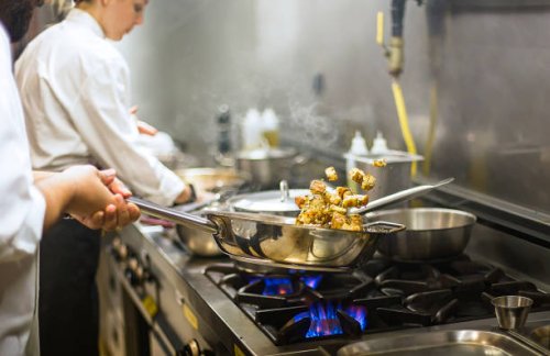 chef preparing cuisine in hotel kitchen - food stock pictures, royalty-free photos & images
