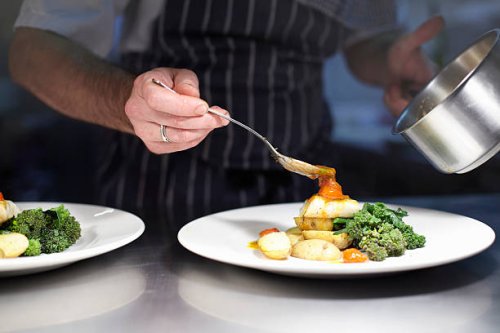 chef preparing dish in kitchen - food stock pictures, royalty-free photos & images