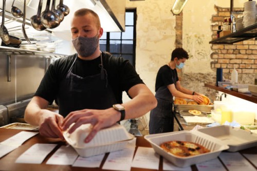 Chef Ray O'Connor prepares for takeaway orders at Ada Restaurant on September 24, 2021 in Auckland, New Zealand. Ada Restaurant in the Auckland...