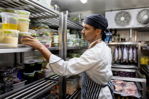 chef working at a restaurant and looking for some ingredients in the pantry - food stock pictures, royalty-free photos & images