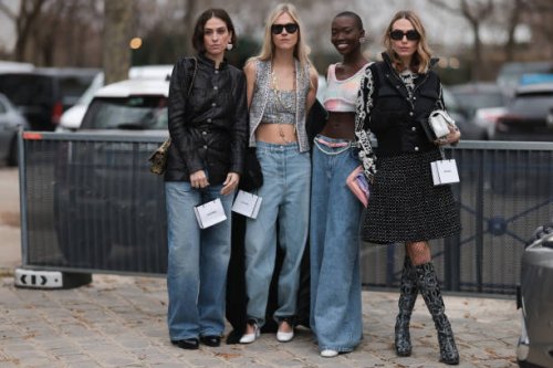 Chiara Baratello wears black skirt, vest, white bag & Linda Tol wears denim jeans, grey cropped top, vest & Erika Boldrin wears black jacket, denim...