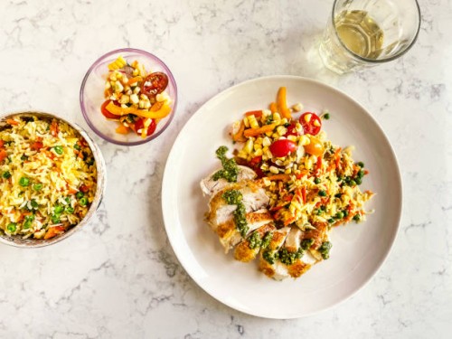 chicken breast, fried rice, and salad on a plate on white, marble background - food stock pictures, royalty-free photos & images