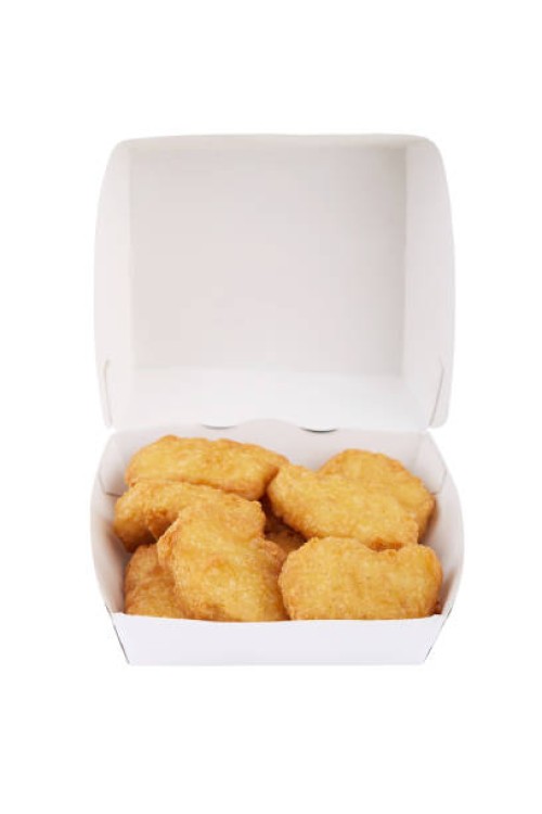 chicken nuggets in a white cardboard isolated on white background - junk food stock pictures, royalty-free photos & images