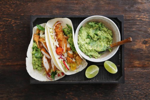 chicken taco with guacamole and mixed vegetables - junk food stock pictures, royalty-free photos & images