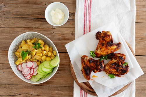 chicken wings on wooden plate, salad and mayonnaise - junk food stock pictures, royalty-free photos & images