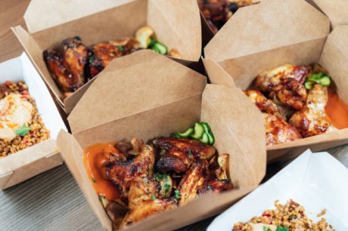 chicken wings packed to take away - junk food stock pictures, royalty-free photos & images