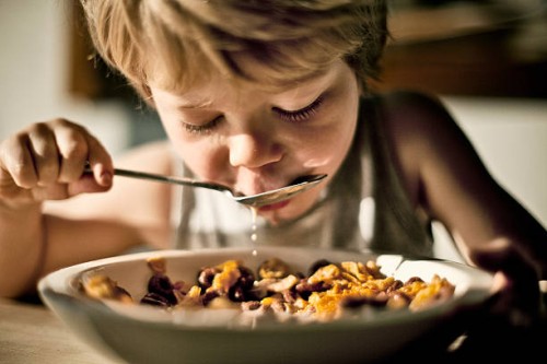 child eating cereal - food stock pictures, royalty-free photos & images