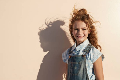 child portrait on studio background - fashion stock-fotos und bilder