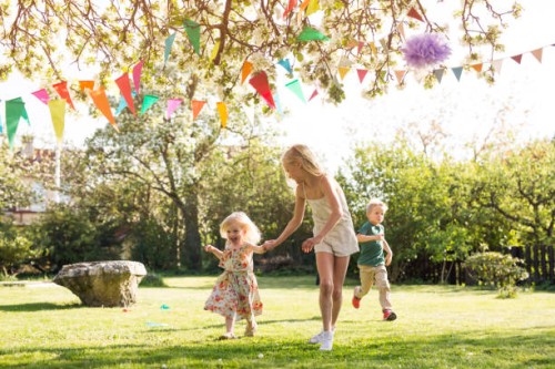 children (18-23 months, 4-5, 8-9) running in garden - garden decoration stock pictures, royalty-free photos & images