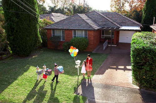 children arriving at birthday party with gifts - garden decoration stock pictures, royalty-free photos & images