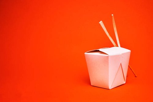 chinese takeout container with chopsticks, isolated on red - junk food stock pictures, royalty-free photos & images