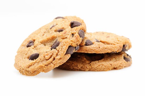 chocolate chip cookies on white - junk food stock pictures, royalty-free photos & images
