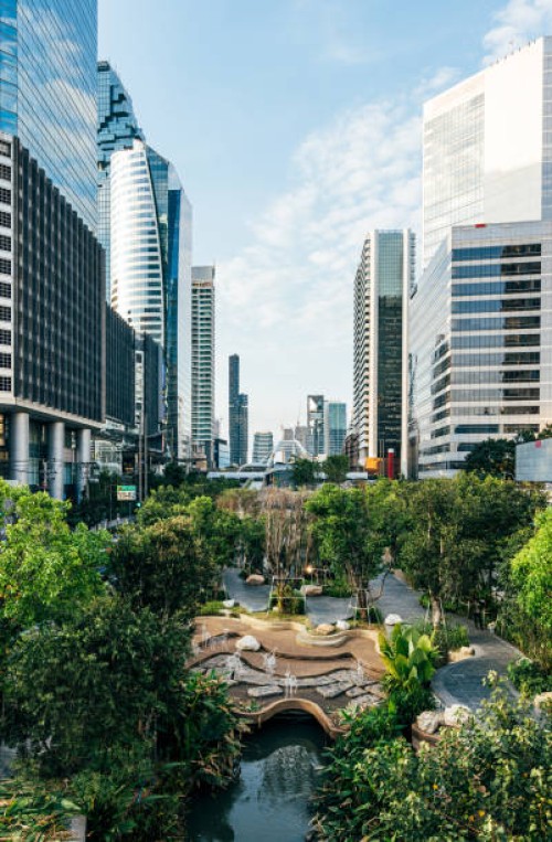 chong nonsi canal park with fresh greenery surrounded by modern futuristic skyscrapers in bangkok, thailand - garden decoration stock pictures, royalty-free photos & images