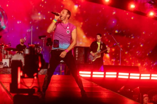 Chris Martin, Guy Berryman and Will Champion of Coldplay perform live on stage at Parken Stadium on July 5, 2023 in Copenhagen, Denmark.