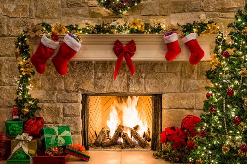 christmas fireplace, tree, stockings, fire, hearth, lights, and decorations - home decoration stock pictures, royalty-free photos & images