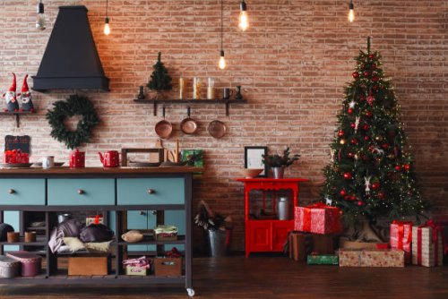 christmas kitchen decor. cooking festive food in the kitchen. new year. christmas. christmas decor. christmas tree. christmas background. christmas home interior decor. holiday. loft style kitchen. - home decoration stock pic