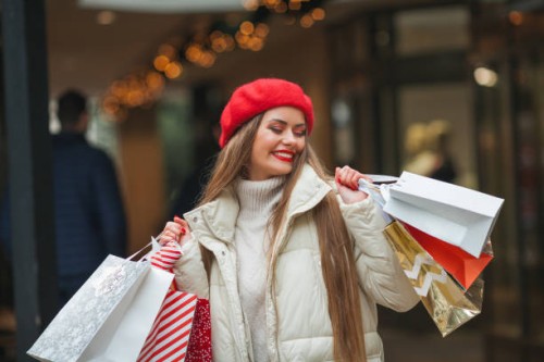 christmas portrait of young happy woman in the center of european city, doing shopping. winter vacations and holidays. gifts - fashion stock pictures, royalty-free photos & images