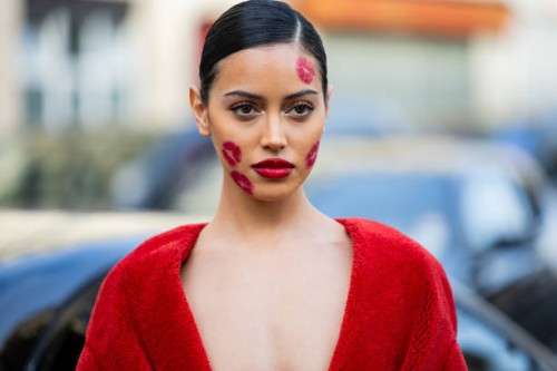 Cindy Kimberly with kiss lip make up wears red dress outside Viktor&Rolf during the Haute Couture Spring/Summer 2024 as part of Paris Fashion Week on...