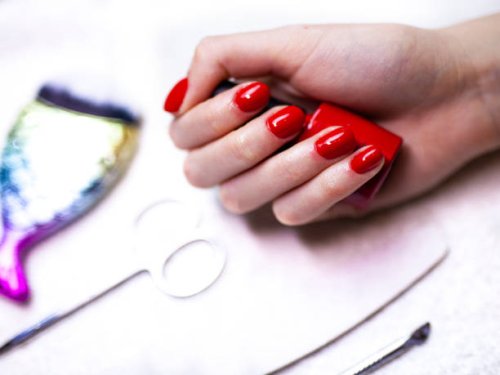 client at a beauty salon with freshly finished nails - nails art stock pictures, royalty-free photos & images