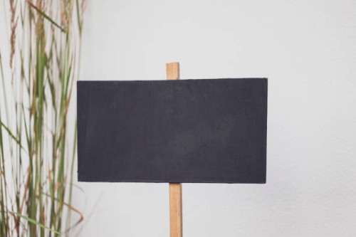 close-up blackboard in front of a wall. decoration service at a garden party, summer festival, or wedding. catering. - garden decoration stock pictures, royalty-free photos & images