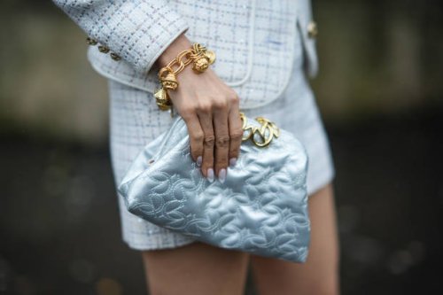 Close-up detail view of a golden bracelet, and an Elie Saab pouch bag, outside Elie Saab, during the Womenswear Fall/Winter 2024/2025 as part of...