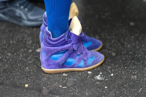 Close-up detail view of blue and purple ankle sneakers shoes with suede details, outside Magliano, during the Milan Fashion Week Menswear Fall/Winter...