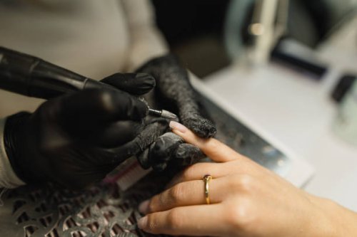 close-up: nail polish removal in beauty salon - nails art stock pictures, royalty-free photos & images