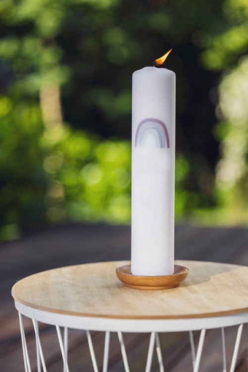 close-up of a baptism candle. garden party, summer festival, birthday party, baptism or wedding. - garden decoration stock pictures, royalty-free photos & images