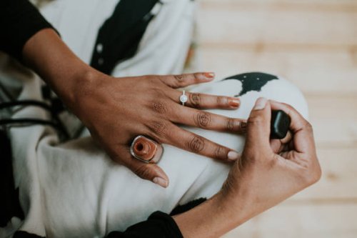 close-up of a black woman painting her fingernails brown - nails art stock pictures, royalty-free photos & images