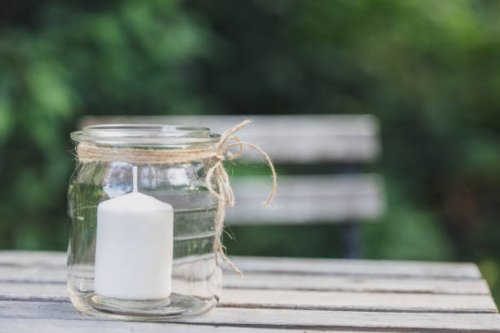 close-up of a candle in a glass. decoration service at a garden party, summer festival, or wedding. catering. - garden decoration stock pictures, royalty-free photos & images