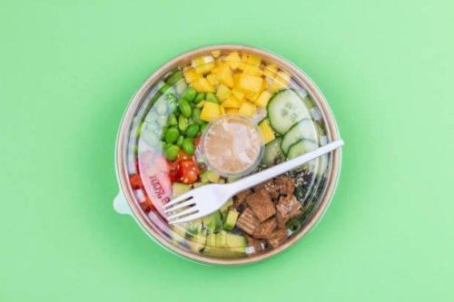 close-up of a healthy lunch in a plastic container on green background. - junk food stock pictures, royalty-free photos & images
