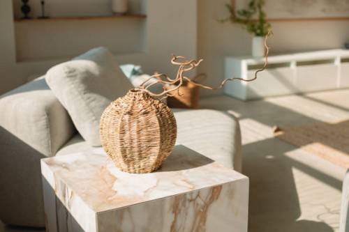 close-up of a wicker vase on a coffee table in a living room - home decoration stock pictures, royalty-free photos & images