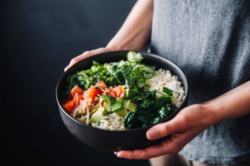 close-up of a woman hands holding a bowl of healthy salad - food stock pictures, royalty-free photos & images